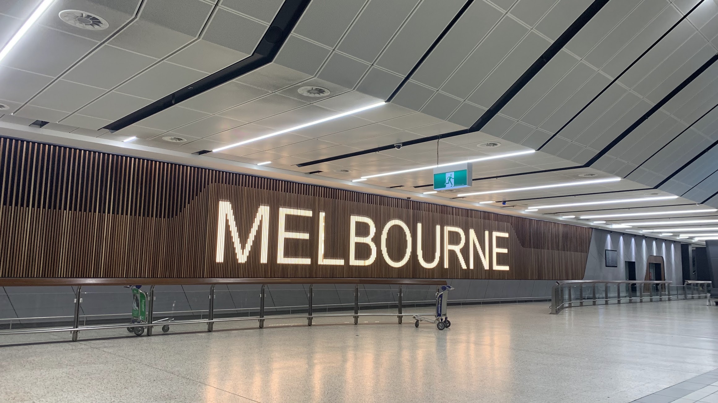 Melbourne sign on the approach to the public T2 International Arrivals Hall