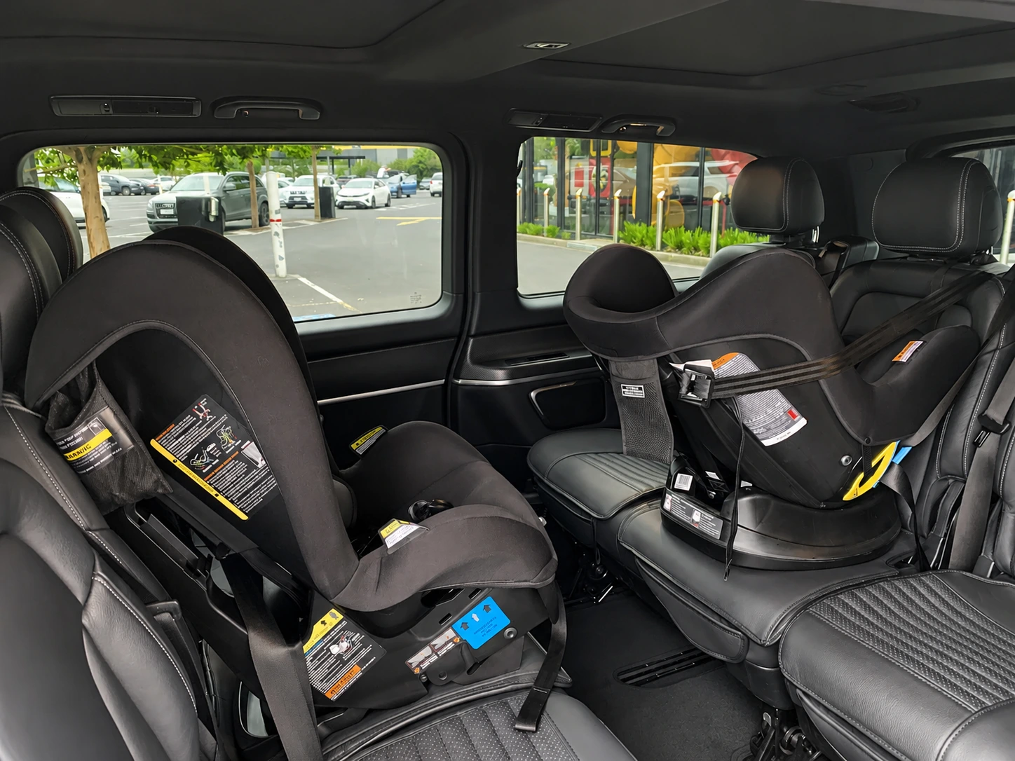 Two child restraints installed in the passenger cabin of a Mercedes-Benz V-Class
